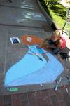 Girl creating chalk art