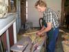 2011 Tour artist Joni O'Donnell making a broom