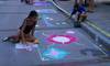 Girl creating chalk art