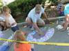 Family with chalk art turtle